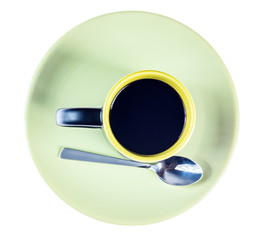 a cup of indian tea on a green plate isolated on a white background