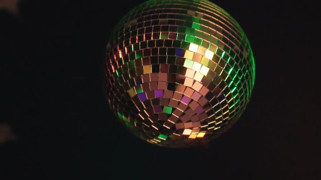 Rotating sparkling disco ball. Concept of night party.
