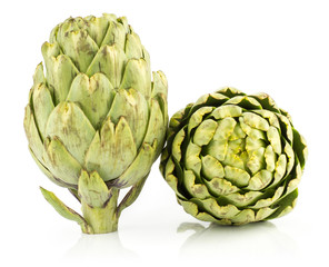 Fototapeta premium Two globe artichoke flowers isolated on white background fresh raw.