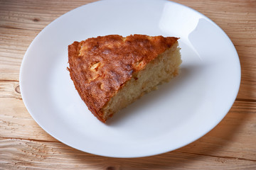 tasty apple pie slice on white plate