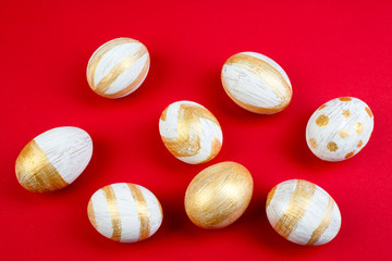 Happy Easter. Painted eggs on red background. Top view. Copy space for text.