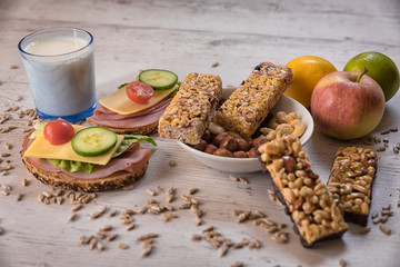 healthy breakfast, cereal sticks in mycelium with nuts, two pans of vegetables laid on the table
