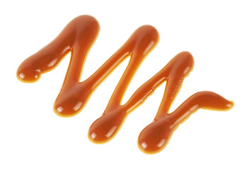 Sweet caramel sauce isolated on white background