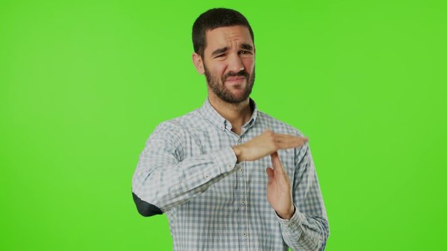 Young man doing a gesture of breaktime