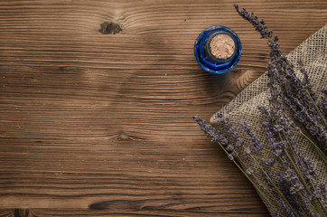 Herbal medicine. Alternative medicine concept. Dry organic natural ingridients. Healing tincture beverage and dry lavender branches on the table.
