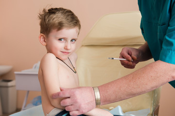 Little brave boy before injection