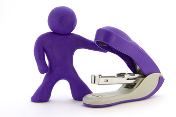 Purple plasticine characters and stapler. Stationery. Isolated on white background