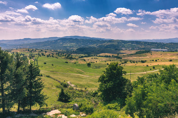 Obraz premium Summer alpine Transylvania landmark, landscape with green fields and valleys, high Piatra Craiului mountains, Carpathians, Transylvania, Romania, Europe