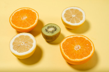 citrus on a yellow background. healthy eating. concept of diet