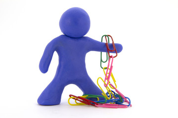 Blue plasticine character and paper clips. Stationery. Isolated on white background