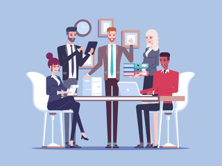 Team business people working together in the office, sitting and standing at the table, working with documents and talking to each other. Busy office work. Business concept teamwork and communication