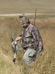 A young Duck Hunter with a Drake Pintail in North Dakota