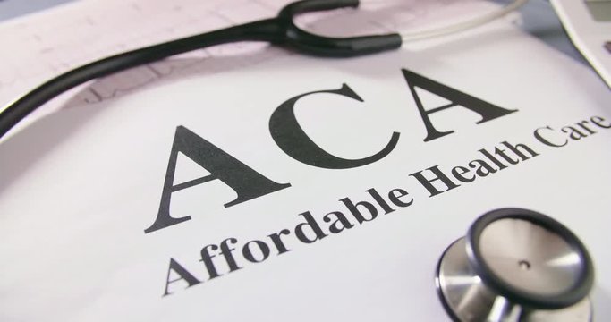 Stethoscope And ECG Report With ACA Text On Paper