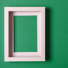 Abstract minimalism colofrul paper background with empty picture frame.