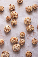 Appetizing pastries-delicious bagels-snails. Confectionery. Vertical. Close up.