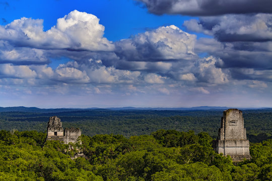 Guatemala. Tikal National Park (UNESCO World Heritage Site since 1979). Amazing view from the top of the Temple IV on surrounding jungle and the tops of pyramids(Temples I, II and III)