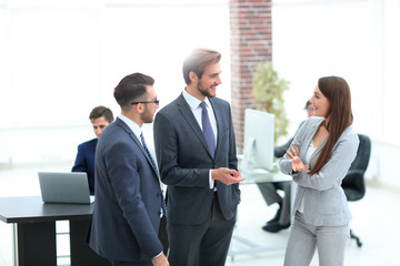Young business woman introduces herself to client.