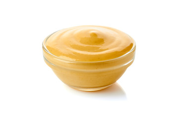 Bowl of mustard on white
