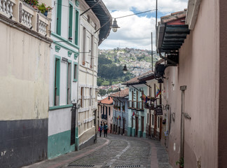 Latin Americian city street in historic section of Quito Ecuador