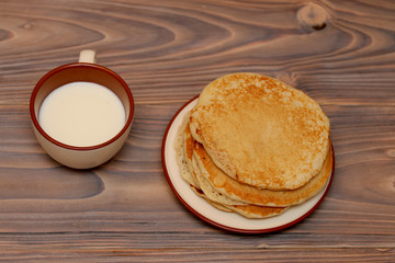food, pancakes on a plate of milk and honey