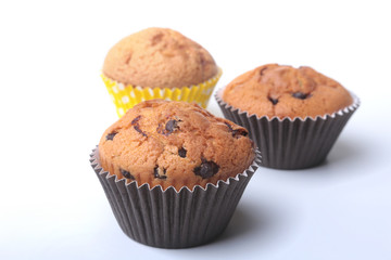 Homemade muffin with raisins and chocolate cupcake. selective focus