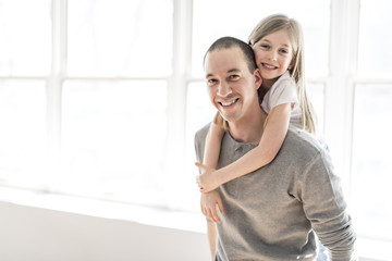 Fototapeta premium Handsome young father and his cute little daughter