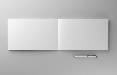 Blank photorealistic brochure with pen mockup on light grey background, 3d Illustration.