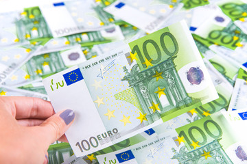 Woman is save  One hundred euro banknote at texture background
