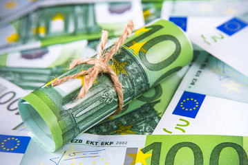 One hundred euro banknote tied up with a rope texture background
