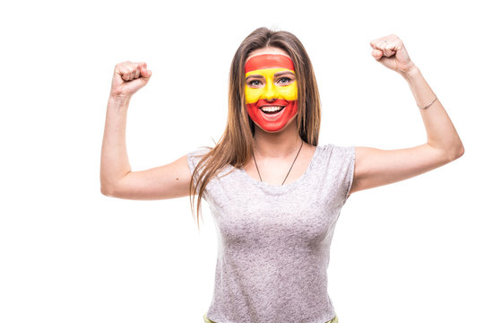 Pretty woman supporter fan of Spain national team painted flag face get happy victory screaming into a camera. Fans emotions.
