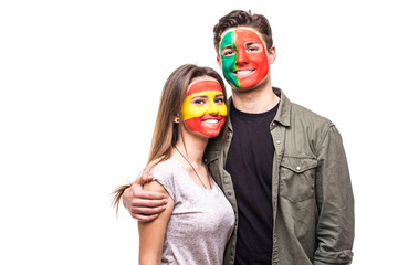 Handsome man supporter fan of Portugal national team painted flag face hug woman supporter fan of...