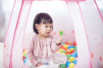 baby girl play tent and ocean ball at home