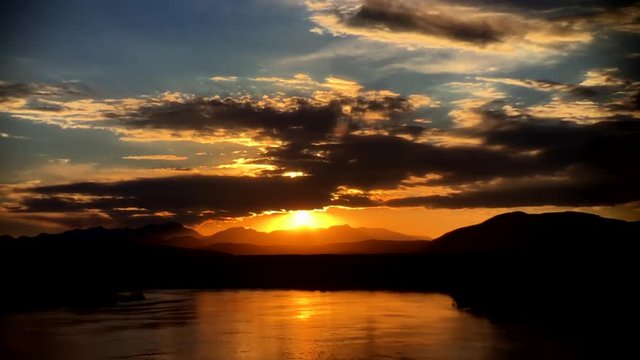 Sunset into Owens river Mammoth Ca. Time-lapse with clouds.