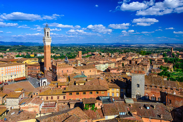 Aerial view of Siena with Campo Square (Piazza del Campo), Palazzo Pubblico and Mangia Tower (Torre del Mangia) in Siena, Tuscany, Italy