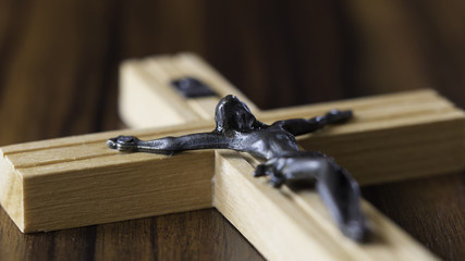 Jesus, I trust you - crucified Jesus on a wooden table background