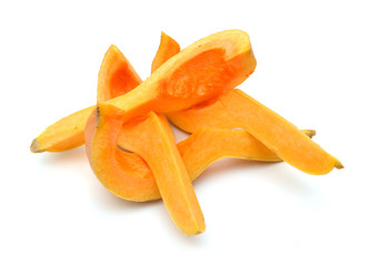 Fototapeta na wymiar Cut up pieces of butternut Pumpkin, isolated on white. Slice of fresh fruit / vegetable.