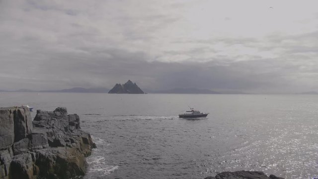 Boat Moving In Atlantic Ocean With Skellig Michael In Background