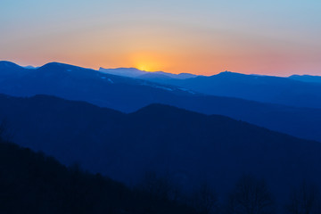 Beautiful evening sunset at Caucasian mountains with snow peaks, Arkhyz, Russia