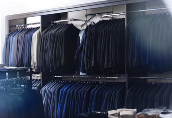 Fototapeta premium Stylish clothes at menswear store