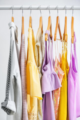 Different clothes on hangers, indoors