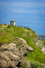 Alpine landscape with small soldiers monument facing the Mediteranean Sea in Beigua National Geopark, Liguria, Italy