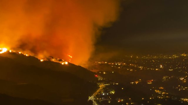 Pan from city to dangerous wildfire in Burbank, California - time lapse
