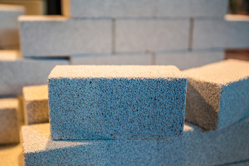 White bricks. The wall is made of porous bricks. Foam concrete. Wall of foam concrete. Construction of aerated concrete.