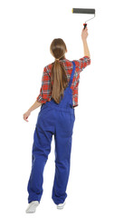 Young female decorator with paint roller on white background