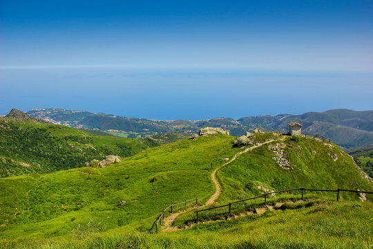 Alpine landscape with small soldiers monument facing the Mediteranean Sea in Beigua National Geopark, Liguria, Italy