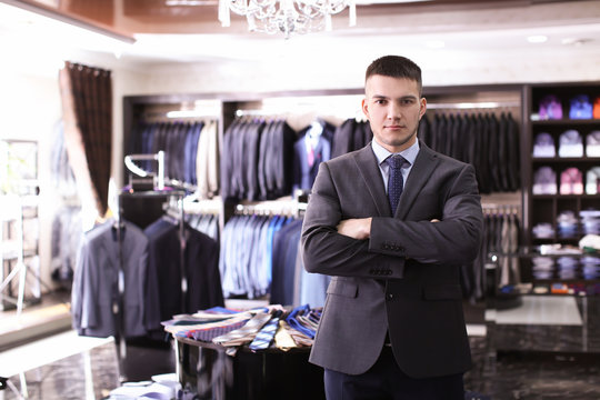Young man wearing elegant suit in boutique
