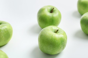 Fresh green apples on white background