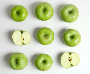 Fresh green apples on white background, flat lay