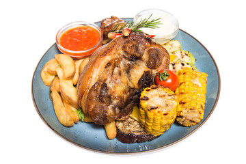 a large piece of meat with corn and potatoes