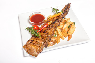 fried fish with garnish  potato isolated on white background
